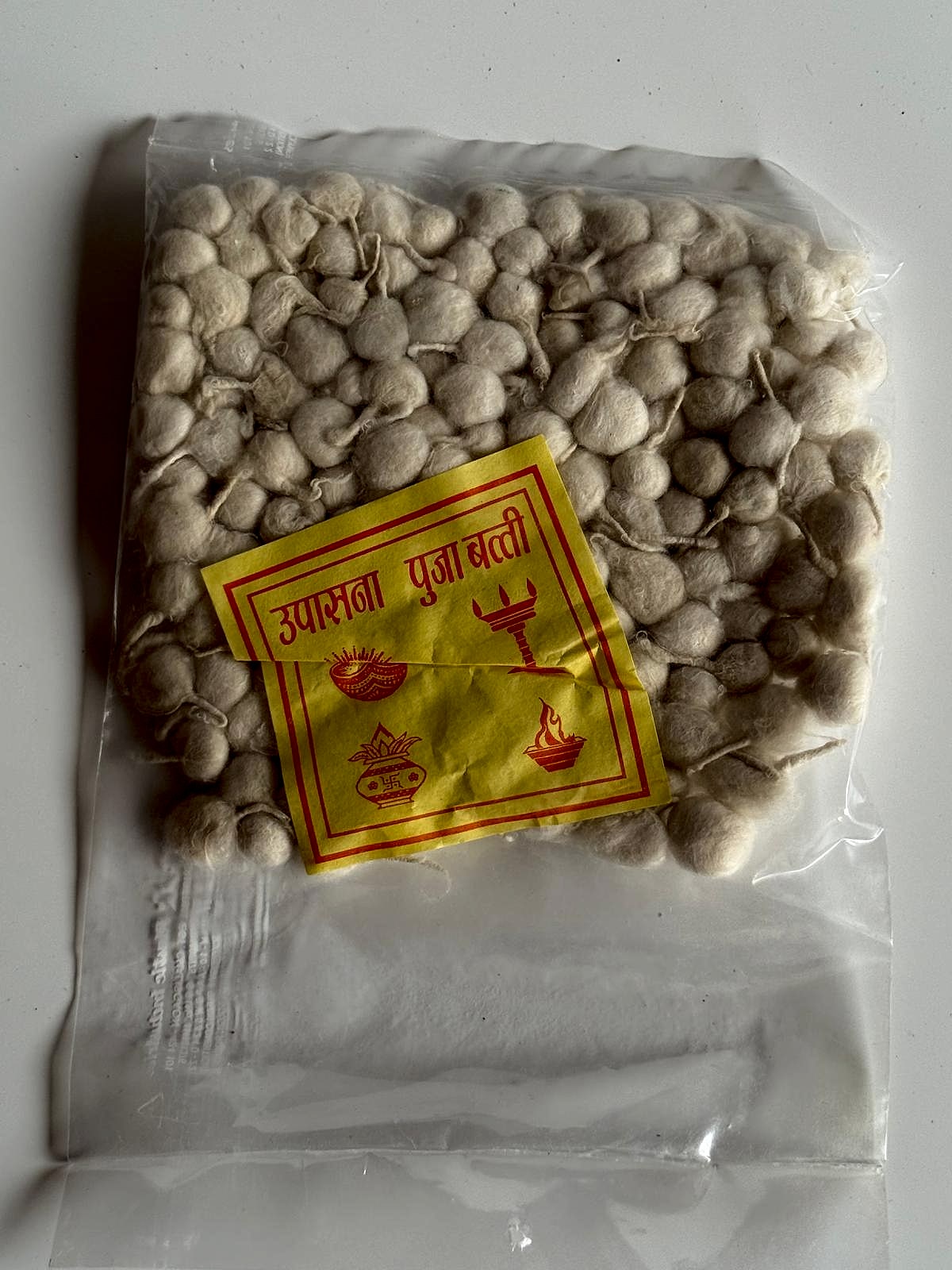 Bag of natural cotton puja batti wicks in clear packaging