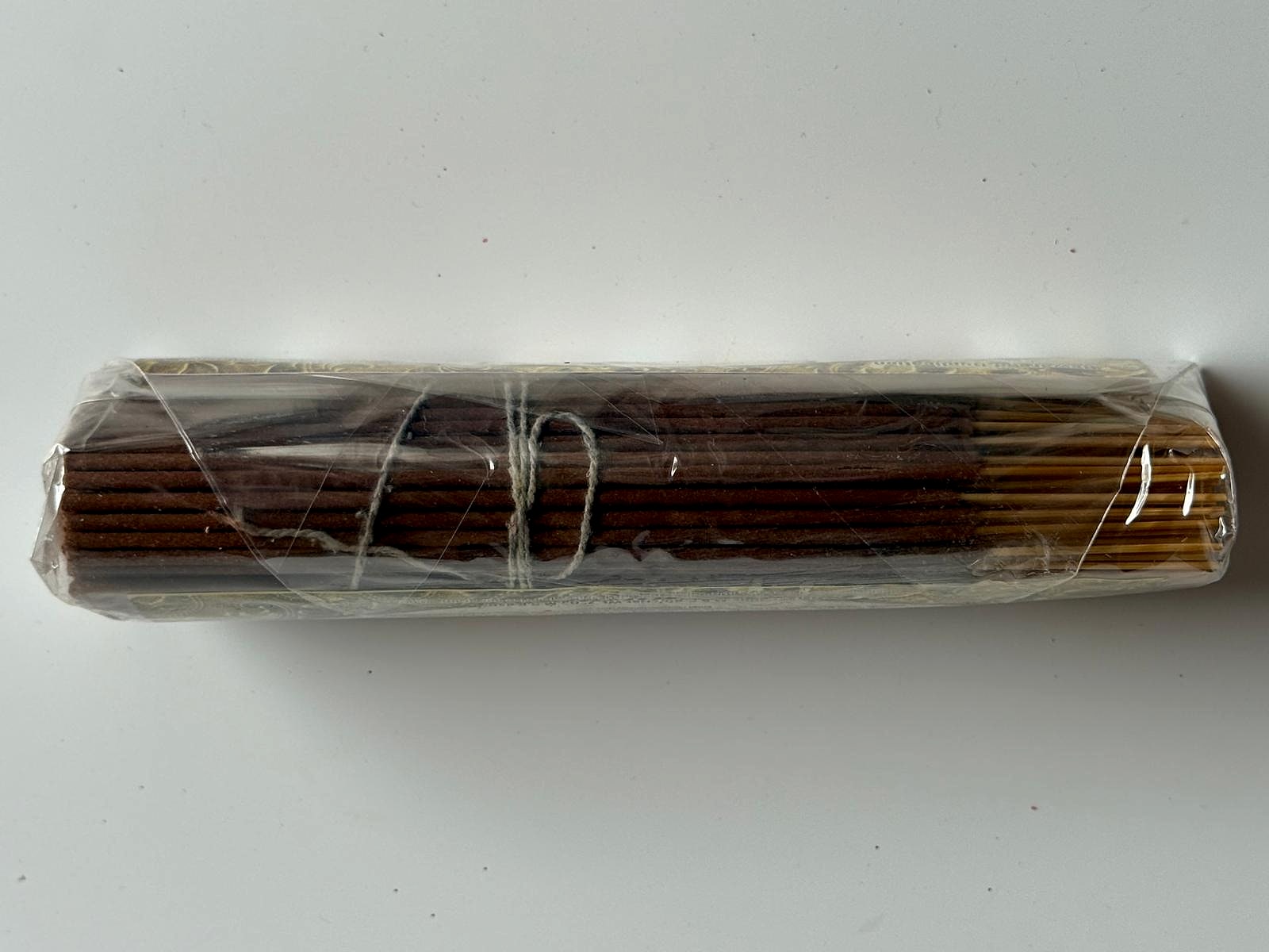 Side view of incense sticks in packaging