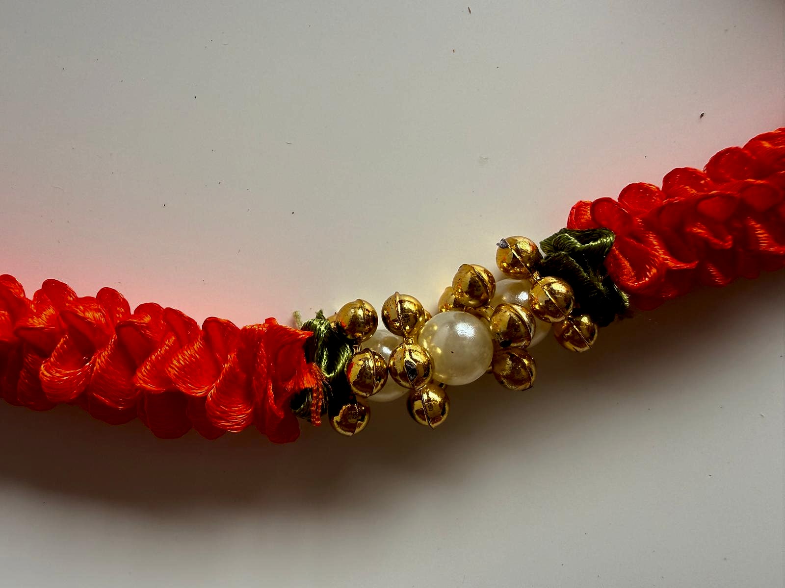 Close-up of pearl and gold bead embellishments