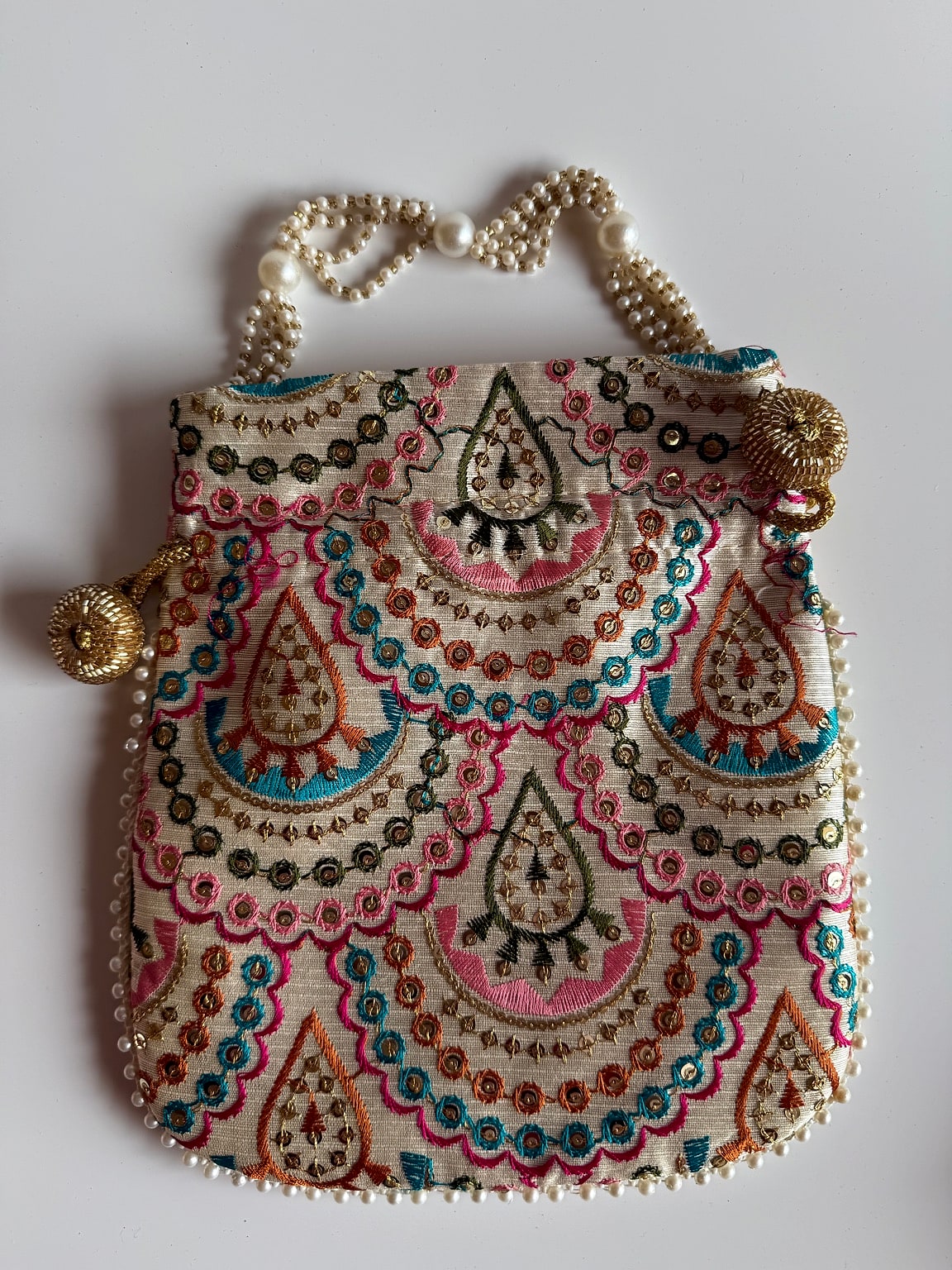 Back view of potli bag with detailed embroidery