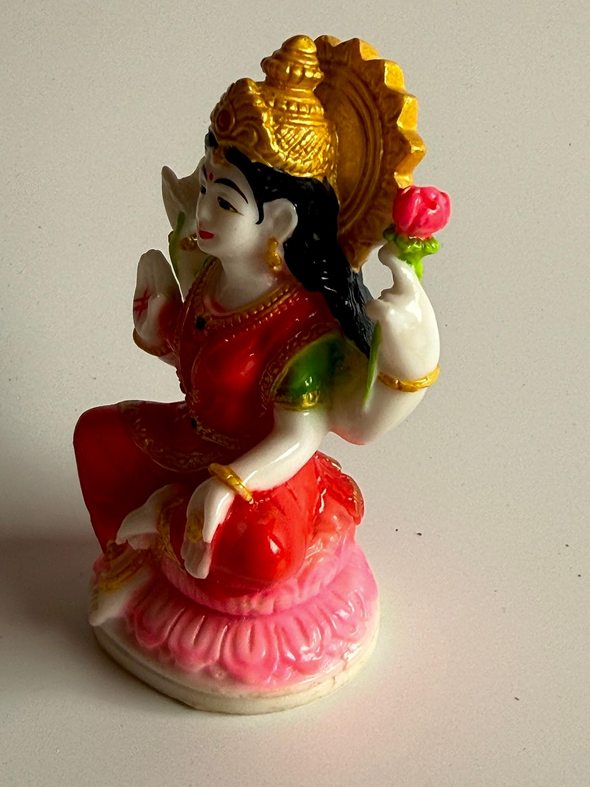 Front view focusing on Lakshmi's serene expression and attire