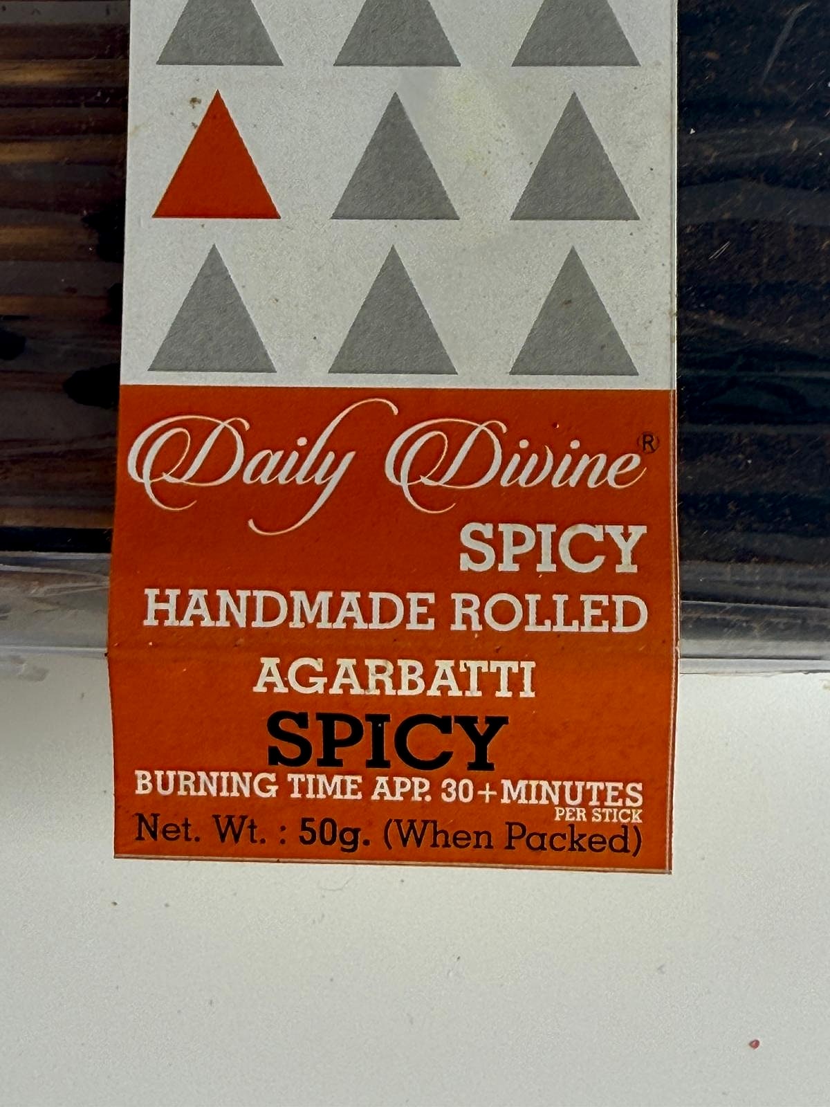 Detailed shot of the descriptive label indicating handmade spicy agarbatti
